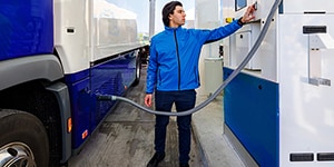 Man refilling a hydrogen vehicle