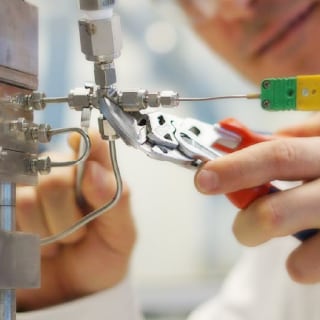 Engineer uses Swagelok tube fittings on a microreactor