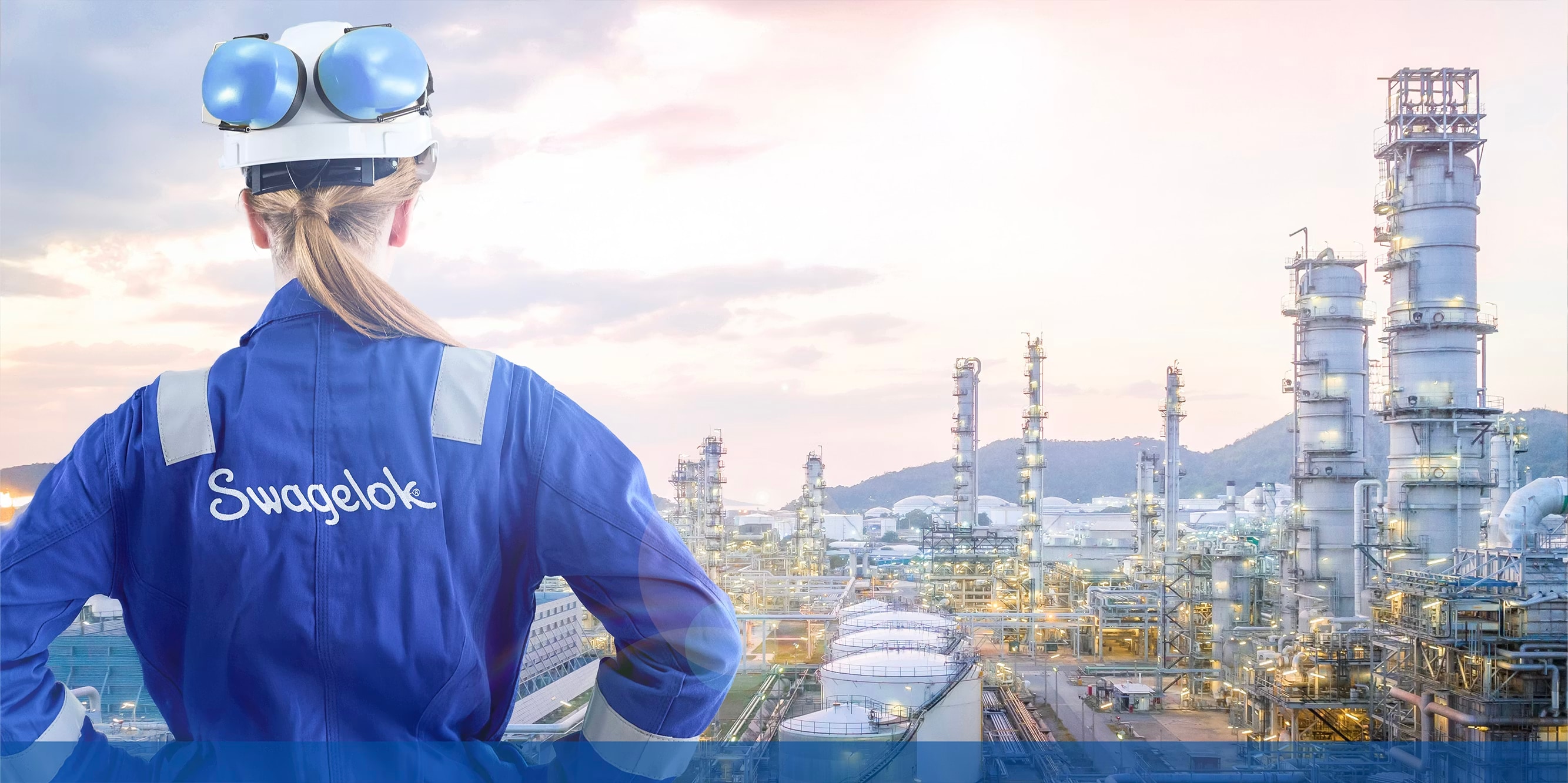 Swagelok field engineer overlooking an oil & gas refinery