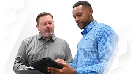 Swagelok field engineer consulting with customer in warehouse