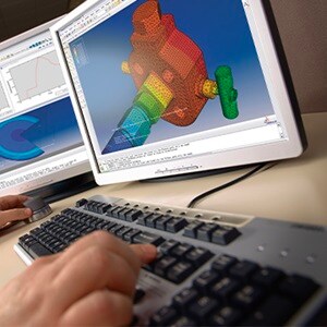 Engineer using CAD to create a detailed design 