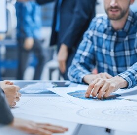 Engineer reviewing front‑end engineering design documentation