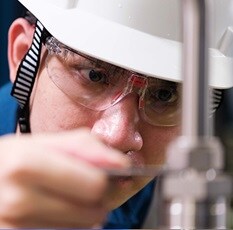 Technician ensuring leak-tight tube fitting installation