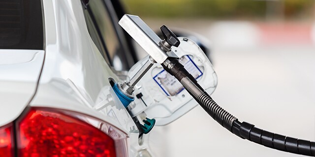 CNG (compressed natural gas) vehicle being refueled